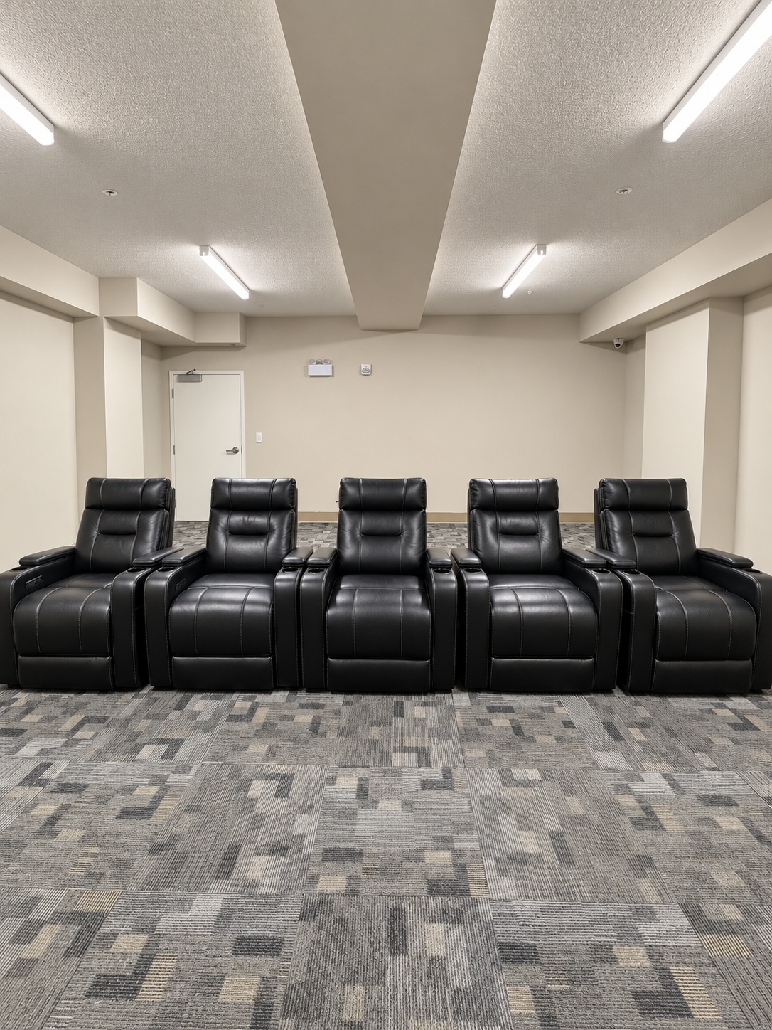 Condo amenity theatre room recliners before renovation